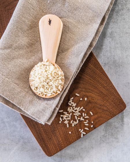 Raw scoop of sustainably grown Andy's Charleston Gold heiroom White Rice